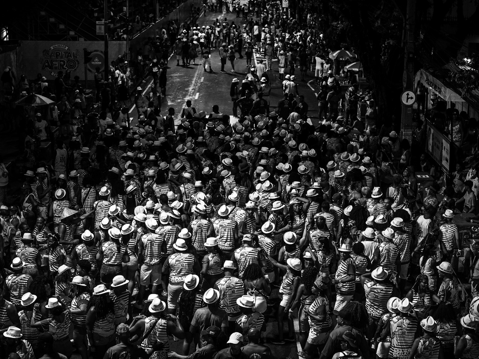 a large group of people walking down a street